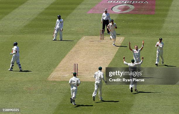 Peter Siddle of Australia celebrates after taking the wicket of Thilan Samaraweera of Sri Lanka during day one of the Third Test match between...