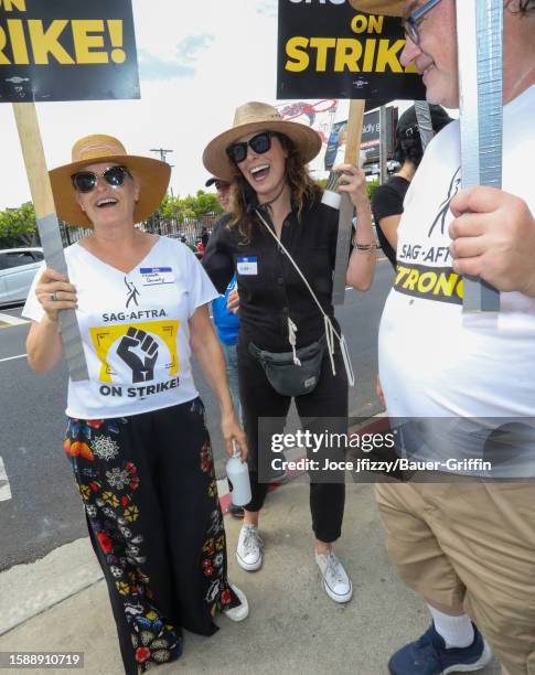 Elizabeth Dennehy and Michelle Forbes are seen at the SAG-AFTRA picket line in front of Paramount Studios on August 09, 2023 in Los Angeles,...