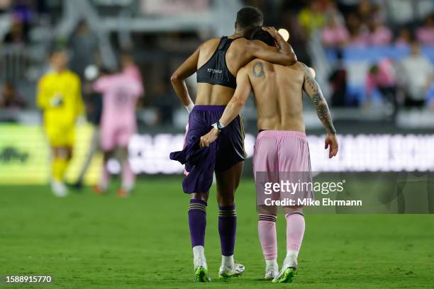 Rafael Santos of Orlando City SC hugs Lionel Messi of Inter Miami CF following the Leagues Cup 2023 Round of 32 match between Orlando City SC and...