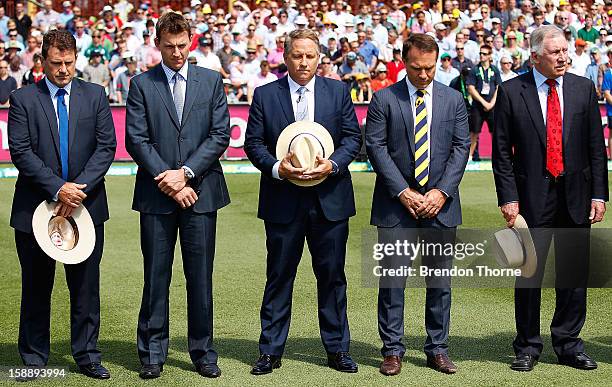 Channel Nine cricket commentators Mark Taylor, Brett Lee, Ian Healy, Michael Slater and Ian Chappell stand in silence to mark the passing of former...