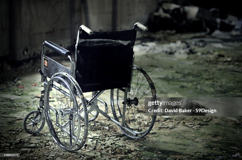 Lone Wheelchair in abandoned mental asylum