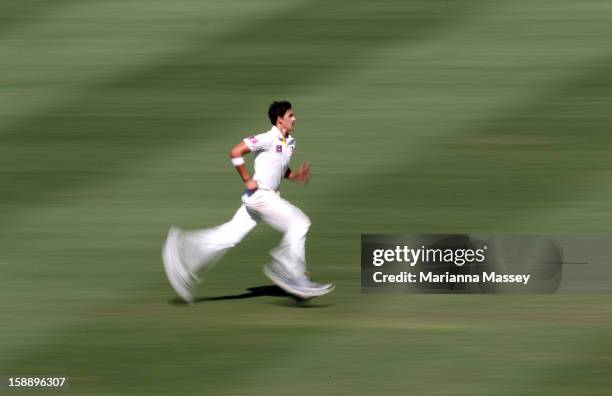 Mitchell Starc of Australia runs into bowl during day one of the Third Test match between Australia and Sri Lanka at Sydney Cricket Ground on January...