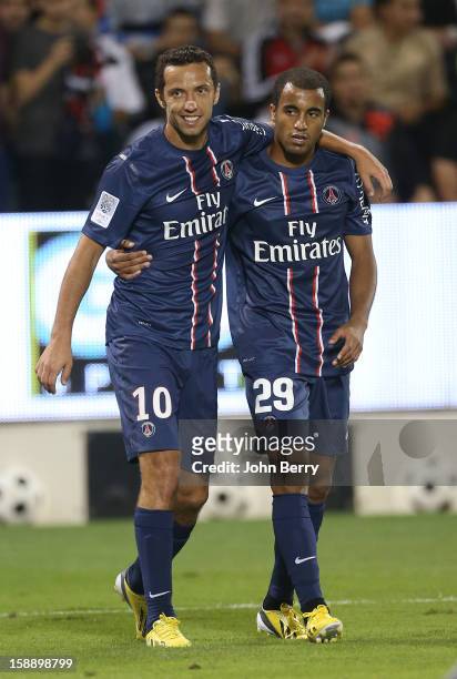 Nene and Lucas Moura of PSG celebrate a goal during the friendly match between Paris Saint-Germain FC and Lekhwiya Sports Club at the Al-Sadd Sports...