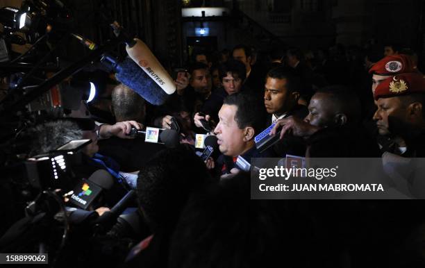 Venezuelan President Hugo Chavez talks to journalists after taking part in the extraordinary UNASUR summit in support of Ecuadorean President Rafael...