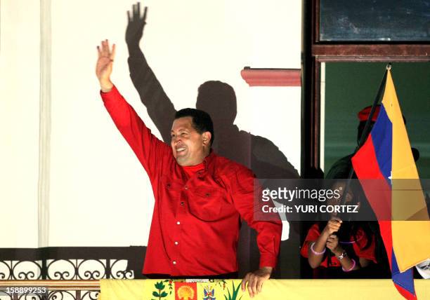 Venezuela's President Hugo Chavez celebrates his victory from the balcony of the Presidencial palace in a referendum on constitutional changes would...