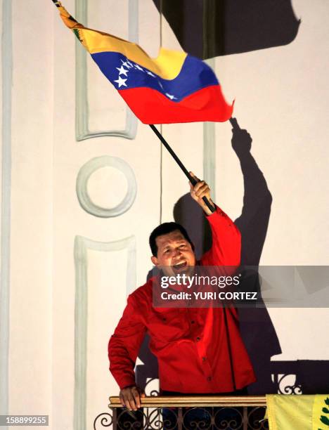 Venezuela's President Hugo Chavez celebrates his victory from the balcony of the Presidencial palace in a referendum on constitutional changes would...