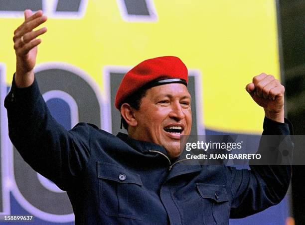 Venezuelan President Hugo Chavez observes an estimated 30,000 people who marched, 11 November 2000, on the streets of Caracas in support of a union...