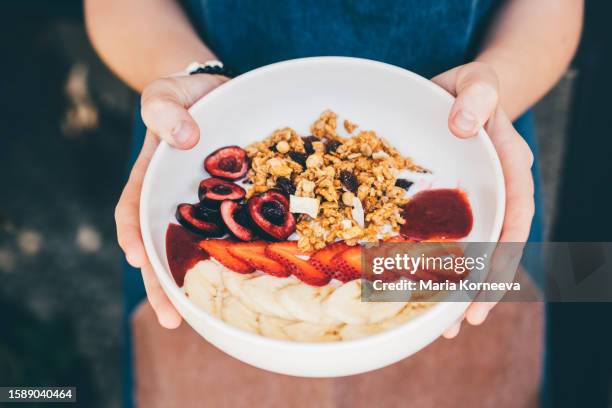 healthy fruity superfood smoothie bowl at cafe. - fibre stock pictures, royalty-free photos & images