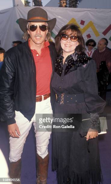 Actor Jameson Parker and wife Bonnie Parker attend 37th Annual SHARE Boomtown Party on May 19, 1990 at the Santa Monica Civic Auditorium in Santa...