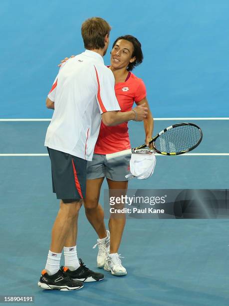Francesca Schiavone and Andreas Seppi of Italy celebrate winning the mixed doubles match against Ashleigh Barty and Bernard Tomic of Australia during...