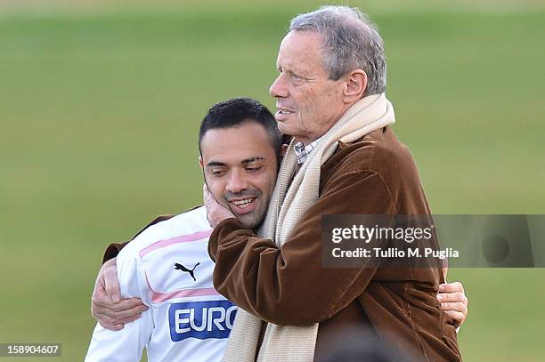 Palermo President Maurizio Zamparini embraces Captain Fabrizio Miccoli before the presentation of Anselmo de Moraes as new player of Palermo at Campo...