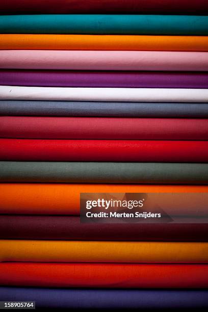 stacked colorful textiles - textile industry fotografías e imágenes de stock