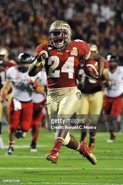 Lonnie Pryor of the Florida State Seminoles runs for a touchdown against the Northern Illinois Huskies during the Discover Orange Bowl at Sun Life...