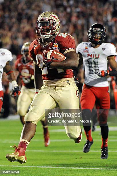 Lonnie Pryor of the Florida State Seminoles runs for a touchdown against the Northern Illinois Huskies during the Discover Orange Bowl at Sun Life...