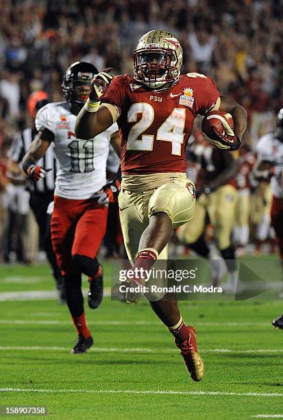 Lonnie Pryor of the Florida State Seminoles runs for a touchdown against the Northern Illinois Huskies during the Discover Orange Bowl at Sun Life...