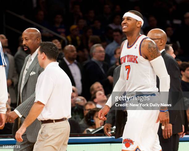 New York Knicks against the Los Angeles Lakers at Madison Square Garden. New York Knicks small forward Carmelo Anthony grimaces in pain as he walks...