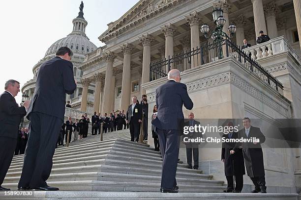 Nearly a year after suffering an major stroke, U.S. Sen. Mark Kirk is escorted by the Senate Sergeant at Arms Terrance Gainer and greeted by U.S....