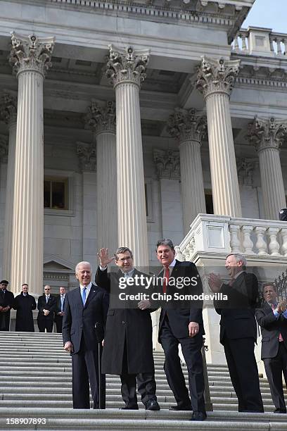 Nearly a year after suffering an major stroke, U.S. Sen. Mark Kirk waves to friends and supporters as he marks his return to the Senate by walking up...