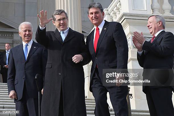 Nearly a year after suffering an major stroke, U.S. Sen. Mark Kirk waves to friends and supporters as he marks his return to the Senate by walking up...