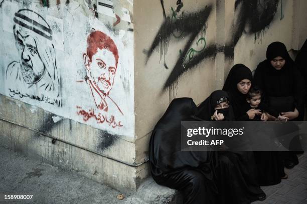 Bahraini Shiite Muslims women attend the Arbaeen religious festival in the village of Sanabis, west of Manama, on January 3 to mark the 40th day...