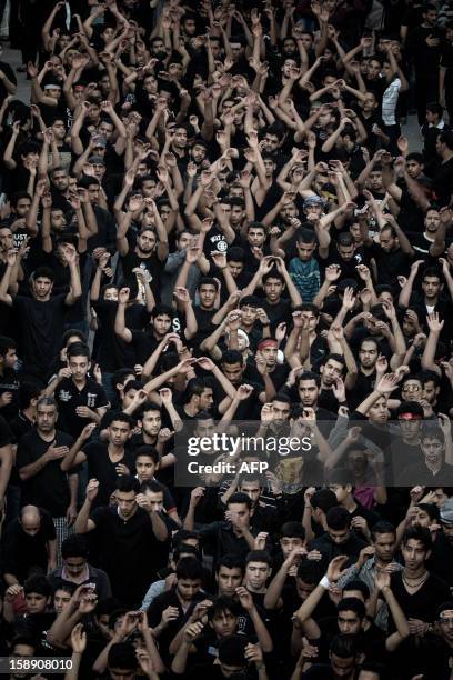 Bahraini Shiite Muslimstake part in the Arbaeen religious festival in the village of Sanabis, west of Manama, on January 3 to mark the 40th day after...