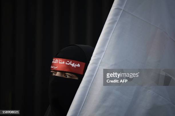 Bahraini Shiite Muslim woman attends the Arbaeen religious festival in the village of Sanabis, west of Manama, on January 3 to mark the 40th day...