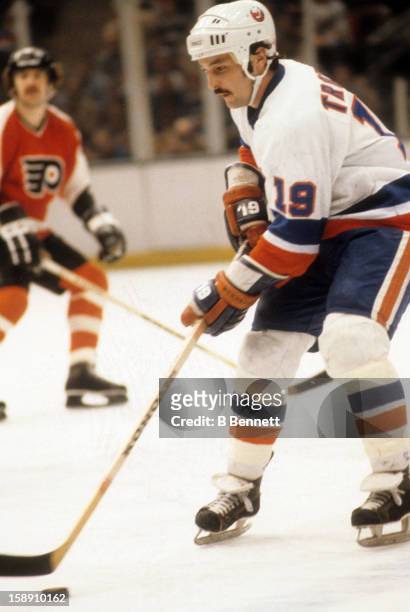 Bryan Trottier of the New York Islanders skates with the puck during an NHL game against the Philadelphia Flyers on April 7, 1979 at the Nassau...