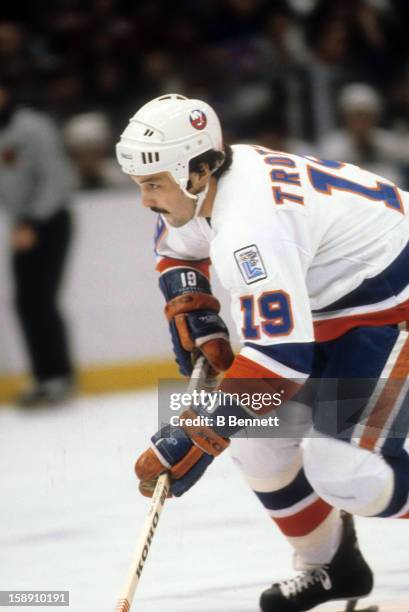 Bryan Trottier of the New York Islanders skates with the puck during an NHL game in December, 1979 at the Nassau Coliseum in Uniondale, New York.