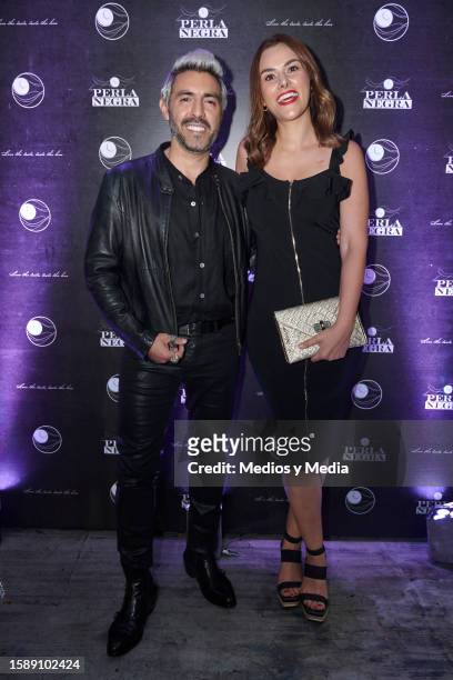 Yogui Mariano and Brenda García poses for a photo during the red carpet in opening of 'La Perla Negra' Restaurant at Colonia Condesa on August 2,...