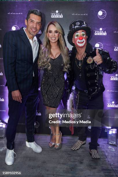 Charly Lopez, Jacky Cervantes and Sergio Verduzco `Platanito´ pose for a photo during the red carpet in opening of 'La Perla Negra' Restaurant at...