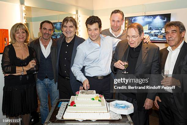 French impersonator Laurent Gerra , who turned 45 on December 29, poses with his mother Nicole, Bruno Solo, Serge Lama, Laurent Bazin, Robert...