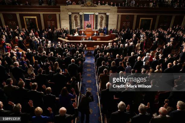 Speaker of the House John Boehner swears in the newly elected members of the first session of the 113th Congress in the House Chambers January 3,...