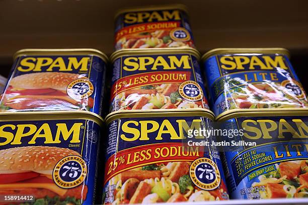 Cans of Spam are displayed on a shelf at Cal Mart grocery store on January 3, 2013 in San Francisco, California. Hormel, the maker of Spam, announced...