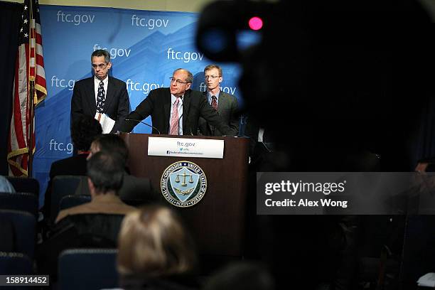 Federal Trade Commission Chairman Jon Leibowitz speaks as Bureau of Competition Director Richard Feinstein , and Bureau of Economics Director Howard...