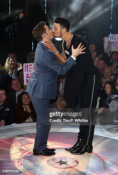 Presenter Brian Dowling kisses Rylan Clark before he enters the Celebrity Big Brother House at Elstree Studios on January 3, 2013 in Borehamwood,...