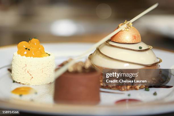 View of the cappuccino mousse dome, orange sanguine and chocolate salted caramel dessert prepared by executive pastry chef Thomas Henzi for the 2013...