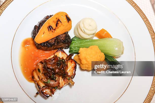 View of the smoked flat iron beef with grilled sweet pickled pepper and California olive oil orange Chilean sea bass with caramelized mint fennel,...