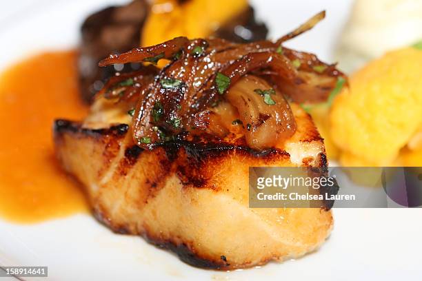 Close-up view of the California olive oil orange Chilean sea bass with caramelized mint fennel entree prepared by executive chef Suki Sugiura for the...