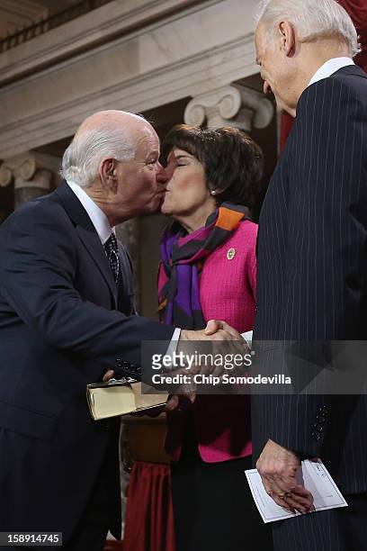 Sen. Ben Cardin kisses his wife Myrna Edelman Cardin while participating in a reenacted swearing-in with U.S. Vice President Joe Biden in the Old...