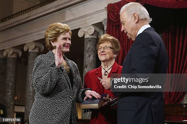 Sen. Debbie Stabenow participates in a reenacted swearing-in with her mother Anna Greer and U.S. Vice President Joe Biden in the Old Senate Chamber...