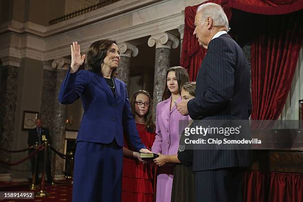 Sen. Maria Cantwell participates in a reenacted swearing-in with her nieces Kendle Clauser, Crystin Clauser and Zoe Furland and U.S. Vice President...