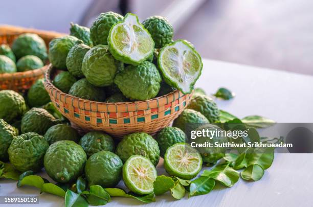 close-up of bergamot in bamboo basket - bergamot stock pictures, royalty-free photos & images