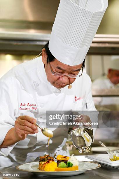 Executive chef Suki Sugiura performs a cooking demonstration to showcase the menu for the 2013 Golden Globe Awards at The Beverly Hilton Hotel on...