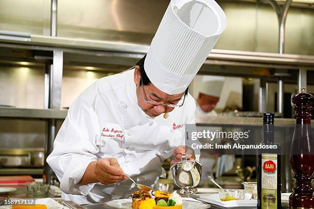 Executive chef Suki Sugiura performs a cooking demonstration to showcase the menu for the 2013 Golden Globe Awards at The Beverly Hilton Hotel on...