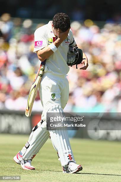 Ed Cowan of Australia looks dejected as he leaves the field after being run out during day two of the Third Test match between Australia and Sri...