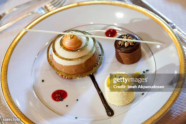 Preview of the cappuccino mousse dome, orange sanguine and chocolate salted caramel dessert prepared by executive pastry chef Thomas Henzi for the...