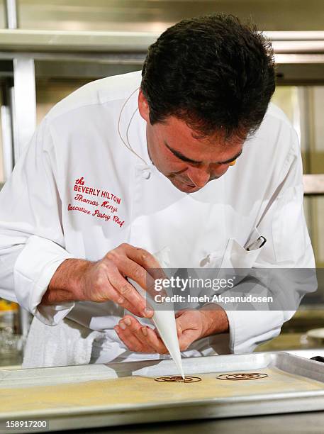 Executive pastry chef Thomas Henzi performs a cooking demonstration to showcase the menu for the 2013 Golden Globe Awards at The Beverly Hilton Hotel...