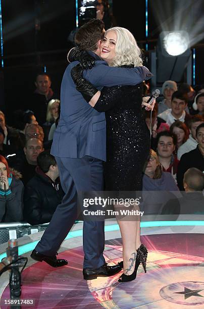 Presenter Brian Dowling with Claire Richards before she enters the Celebrity Big Brother House at Elstree Studios on January 3, 2013 in Borehamwood,...