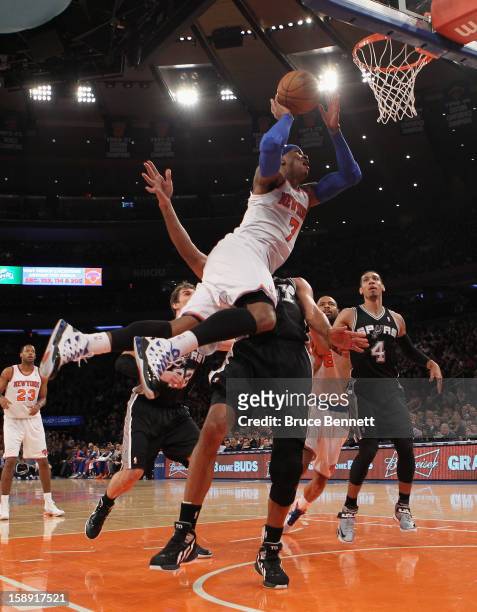 Carmelo Anthony of the New York Knicks scores two in the second quarter against the San Antonio Spurs at Madison Square Garden on January 3, 2013 in...