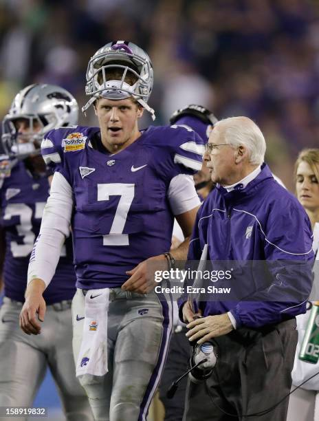 Head coach Bill Snyder talks to Collin Klein of the Kansas State Wildcats during the Tostitos Fiesta Bowl against the Oregon Ducks at University of...